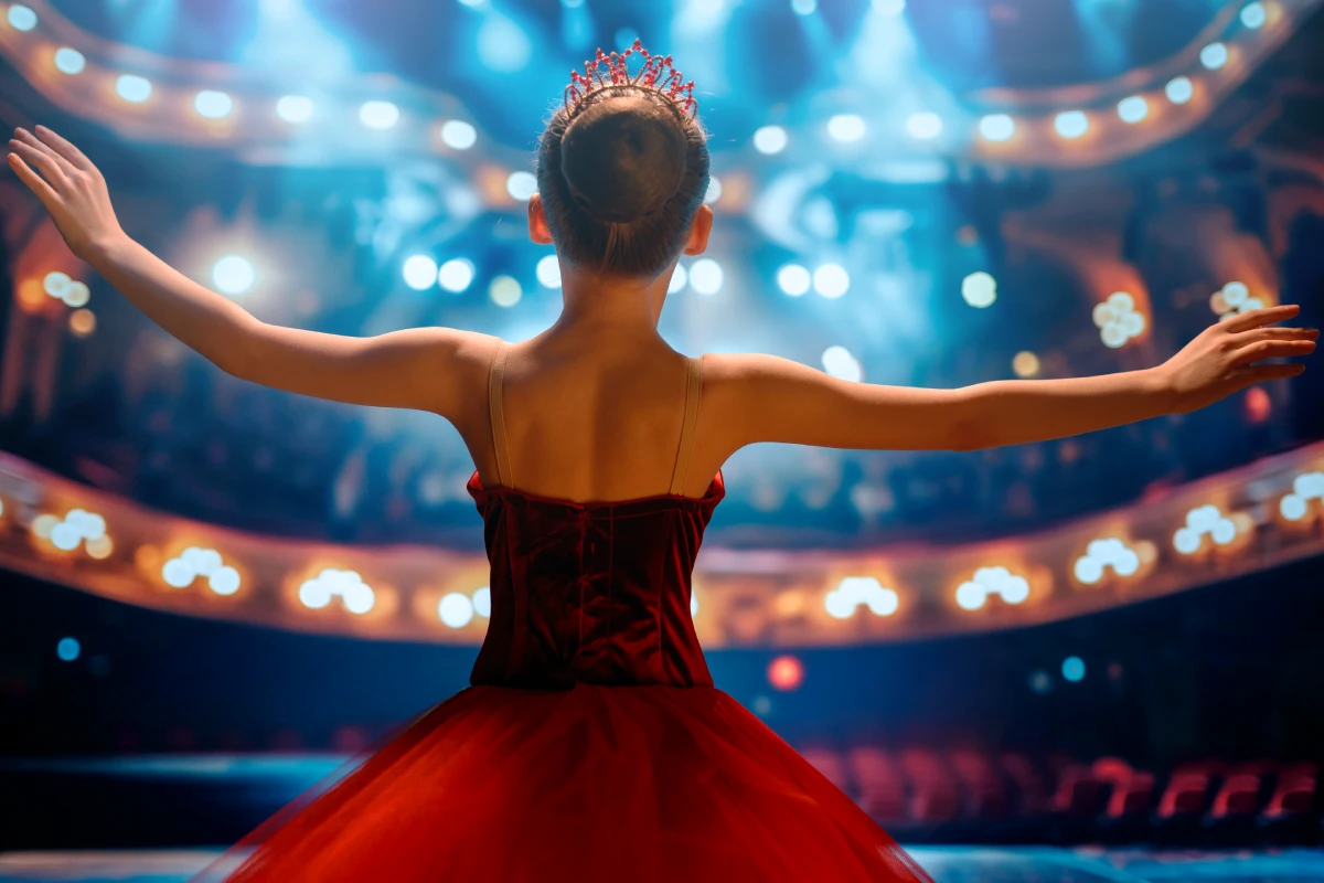 Contestants performing on stage at a dance and ballet competition.